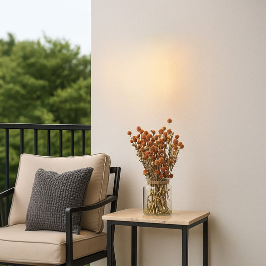 Dried flower arrangement placed on balcony table creating a fresh natural home décor accent with warm earthy textures ideal for balconies patios and relaxed open seating areas.
