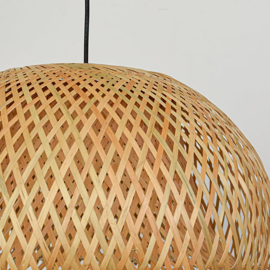 Closeup of natural rattan pendant light showcasing intricate woven bamboo pattern and artisanal dome design.