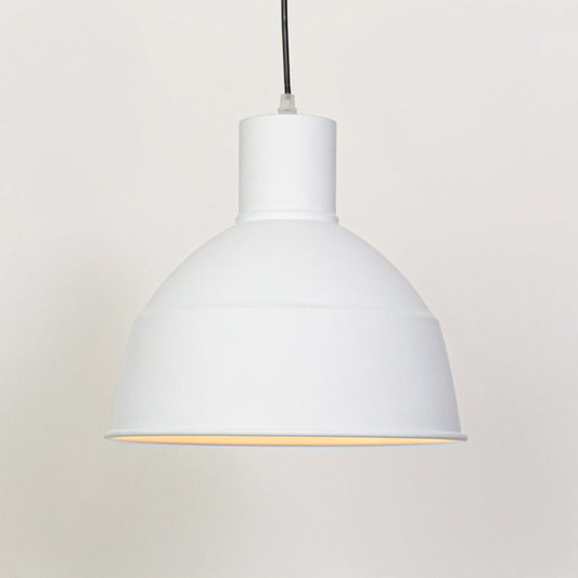 White metal pendant ceiling light switched on against white background producing soft focused downward illumination.