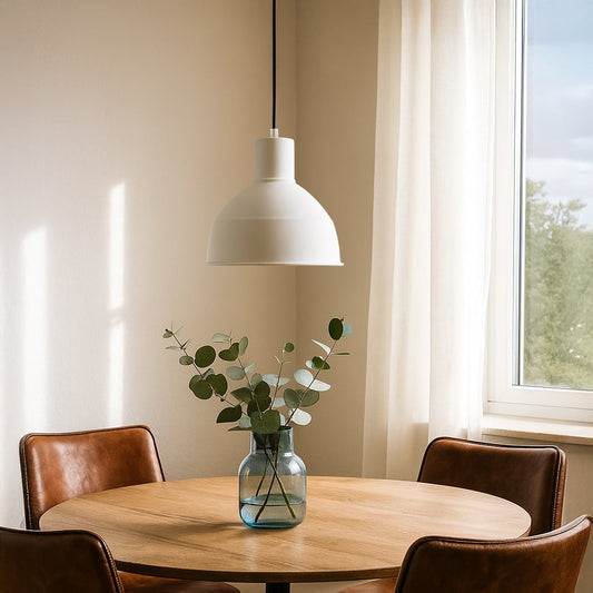 Black metal pendant light enhancing bright dining spaces with timeless elegance and ambient lighting.