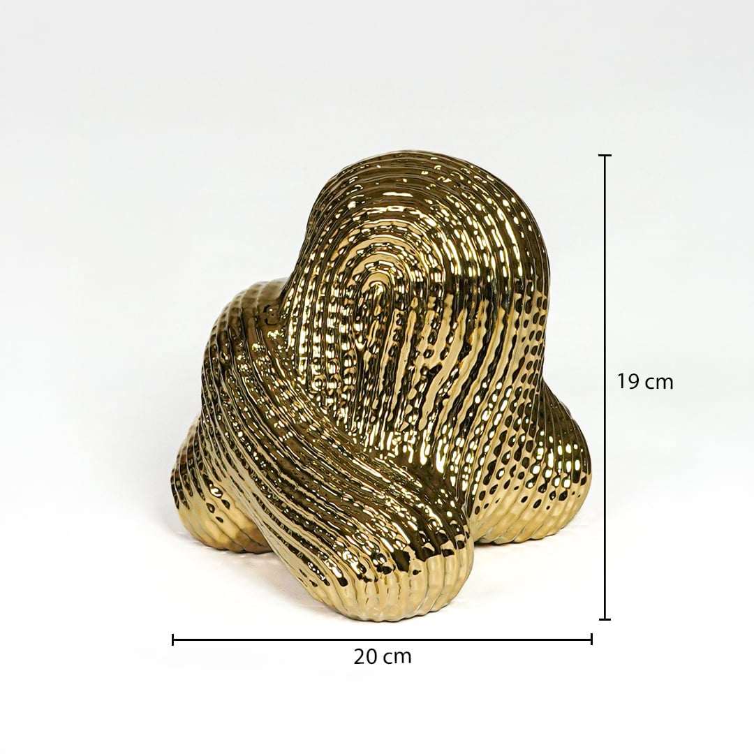 Gold metal abstract sculpture 19 cm height 20 cm width ideal for shelf and tabletop decor placement.