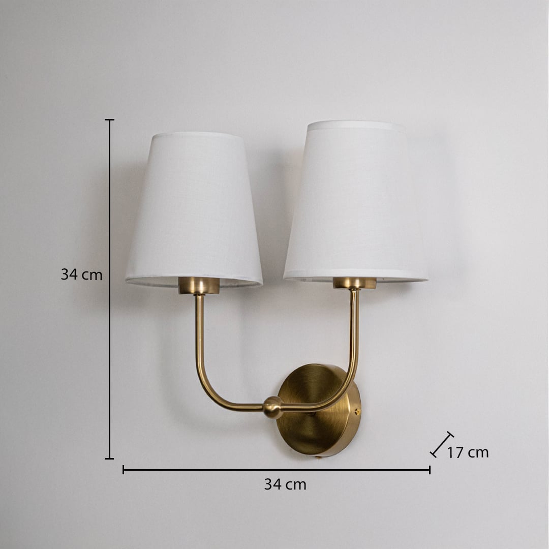 Gold metal double wall sconce with white shades shown with 34 cm height and 34 cm width for accurate size detail.