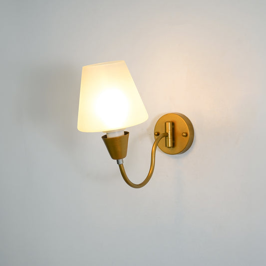White background image of illuminated gooseneck brass swivel wall sconce for elegant modern living room decor styling.