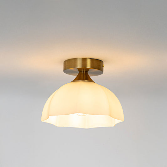 Modern white glass and gold metal ceiling light with warm glow for luxury hallway and traditional decor styling spaces.
