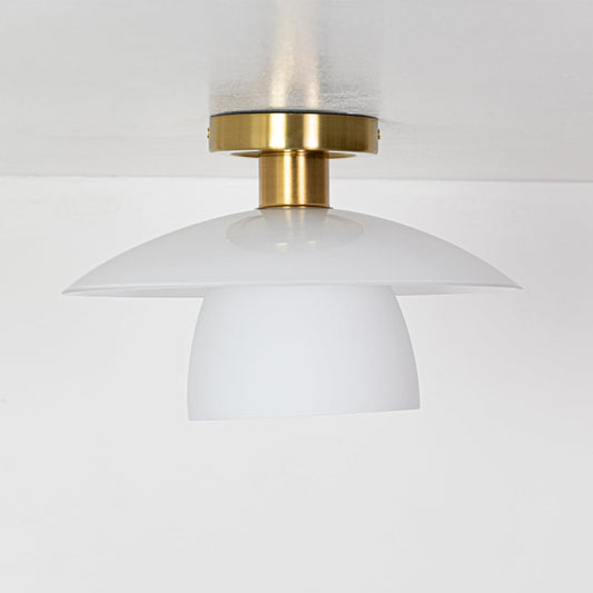 Gold metal ceiling light with smooth white glass shades displayed with lights off on a white background showing its clean contemporary shape.