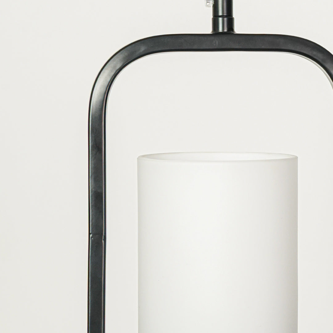 Closeup of black metal and white glass pendant light highlighting refined details and craftsmanship.