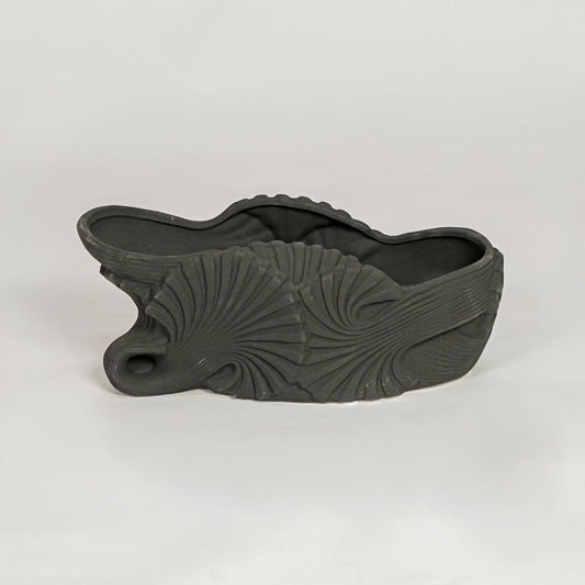 Black ceramic sculpted shell design decorative bowl ideal for fruit display dining table centerpiece and contemporary home decor styling.