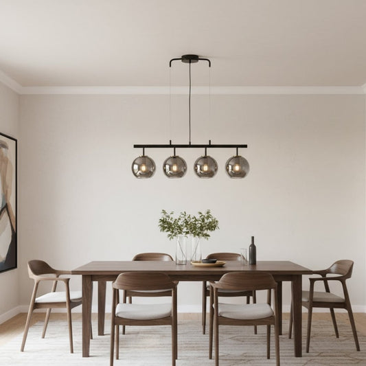 Modern black and chrome chandelier with four reflective glass globes adding luxury style and soft ambient glow to home interiors.