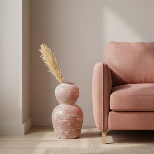 Rustic pink terracotta decorative vase arranged in a designed room setting adding warm textured charm to living rooms entryways and styled corners.