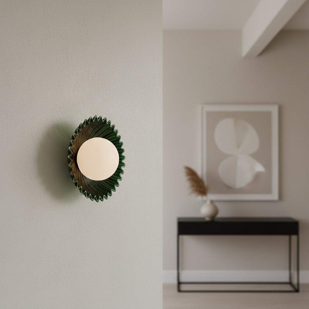 styled as a modern wall light in a soft minimal hallway setting with green fluted metal backplate and glowing glass globe for luxury Decor.