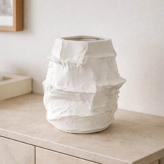 White ceramic flower vase placed on wooden console modern decorative vase for living room shelf table home decor styling.