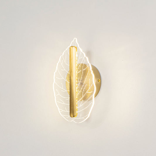 Modern decorative wall light with leaf design and warm glow for bedroom or living decor lighting placement white background.