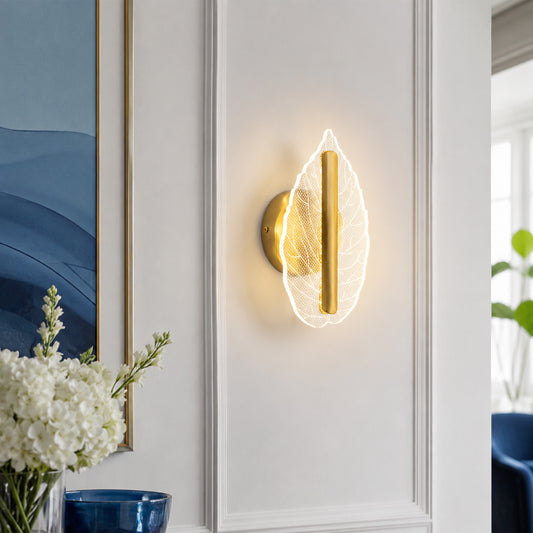 Artistic gold leaf shaped LED wall sconce light fixture casting a bright warm glow in a luxury home hallway panel.