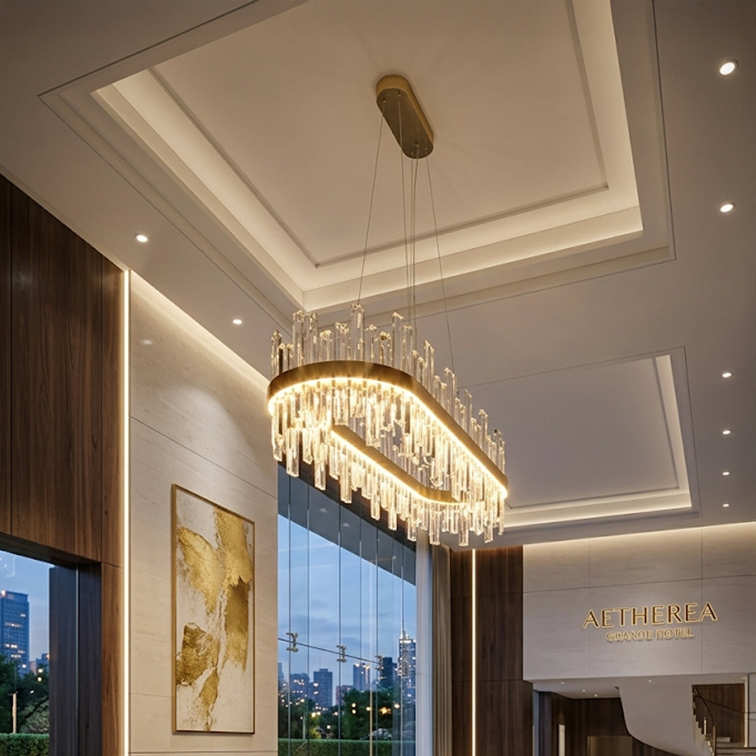 Modern curved crystal chandelier with gold metal frame installed in luxury living room with ceiling design and elegant interior background.
