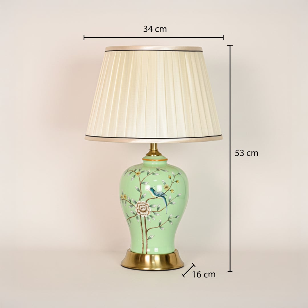 Green ceramic table lamp with floral bird design showing 53 cm height 34 cm shade width and 16 cm base size for placement.