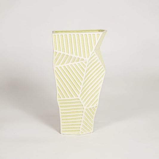 Moss textured ceramic vase medium with rounded sculpted body isolated on clean white background for contemporary decor placement.