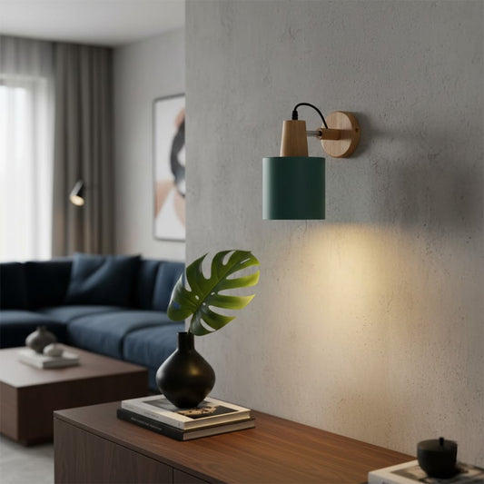 Modern green metal wall light with warm glow for elegant living room and contemporary decor styling spaces.