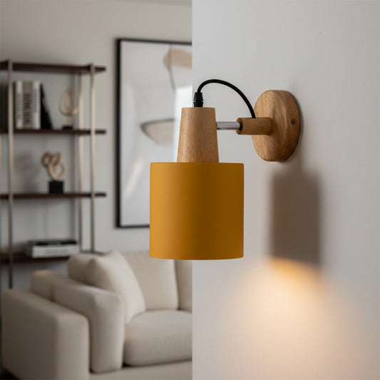 Modern mustard metal and wooden wall light for elegant bedroom and Scandinavian decor styling spaces.