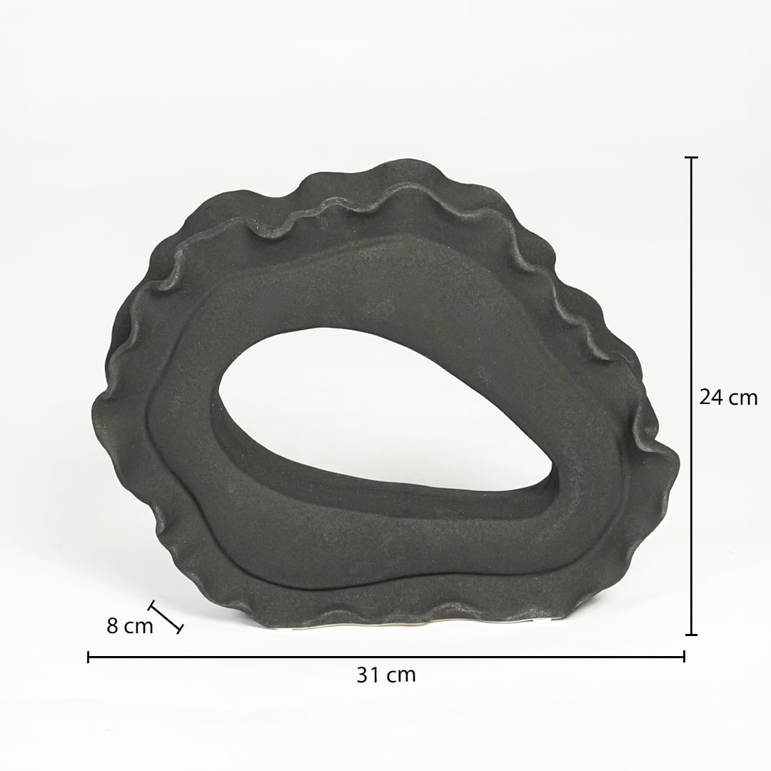 Dark grey ceramic abstract sculpture 24 cm height 31 cm width ideal for shelf and console decor.