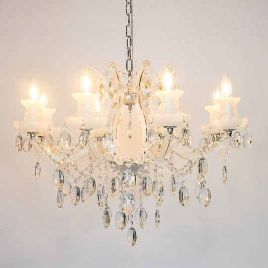 White background image of large gold metal candle style chandelier for modern living room decor styling with a bright warm glow.