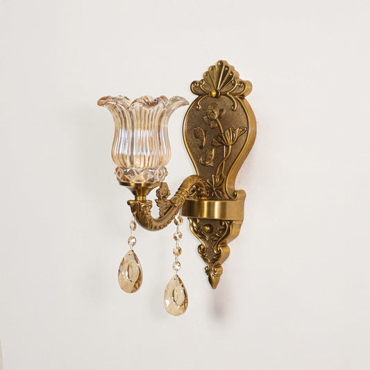 Wall light with antique gold metal frame and amber glass shade displayed on a white background for clear product presentation.