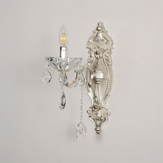 Wall light with silver metal frame and crystal accents displayed on a white background for clear product detailing.