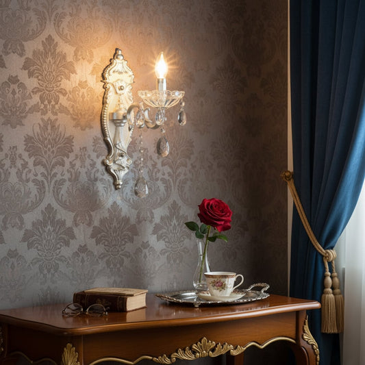 Wall light with silver metal frame and crystal droplets styled on a soft wall background for elegant classic home lighting.