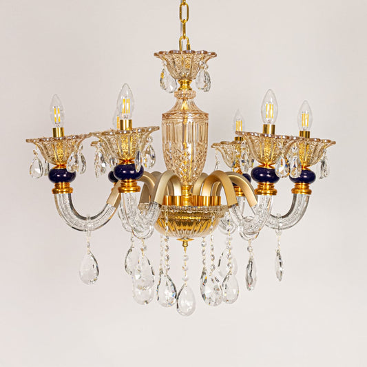 Gold and clear crystal chandelier displayed on white background ideal for classic warm interior ceiling styling.