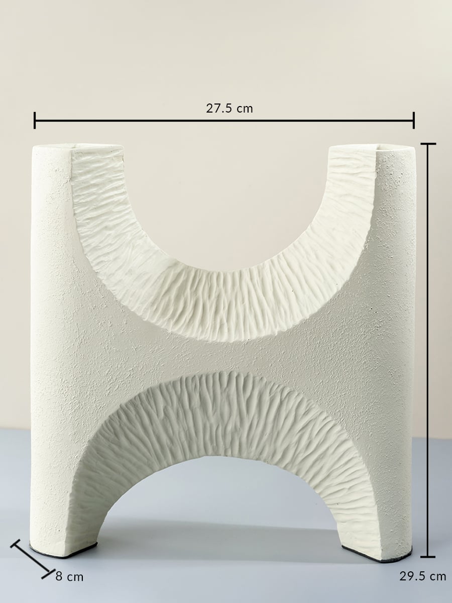 White ceramic decorative vase 29.5 cm height 27.5 cm width and 8 cm depth perfect for table and shelf styling.
