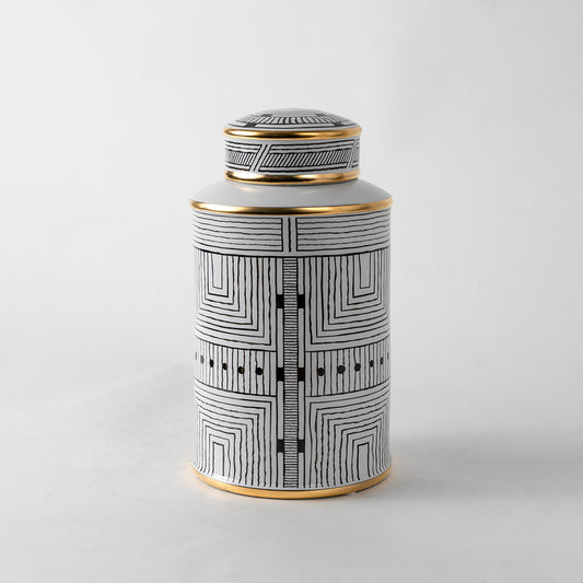 White ceramic decorative jar with geometric black pattern and gold lid for modern shelf styling and home decor.