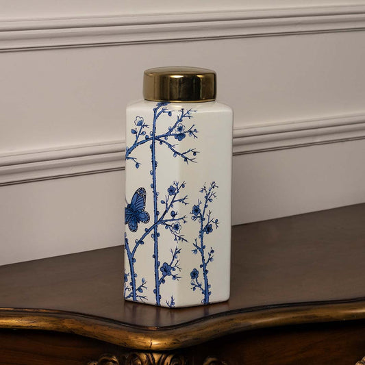 Square ceramic jar with blue floral butterfly design and golden lid crafted for modern luxury home decor styling