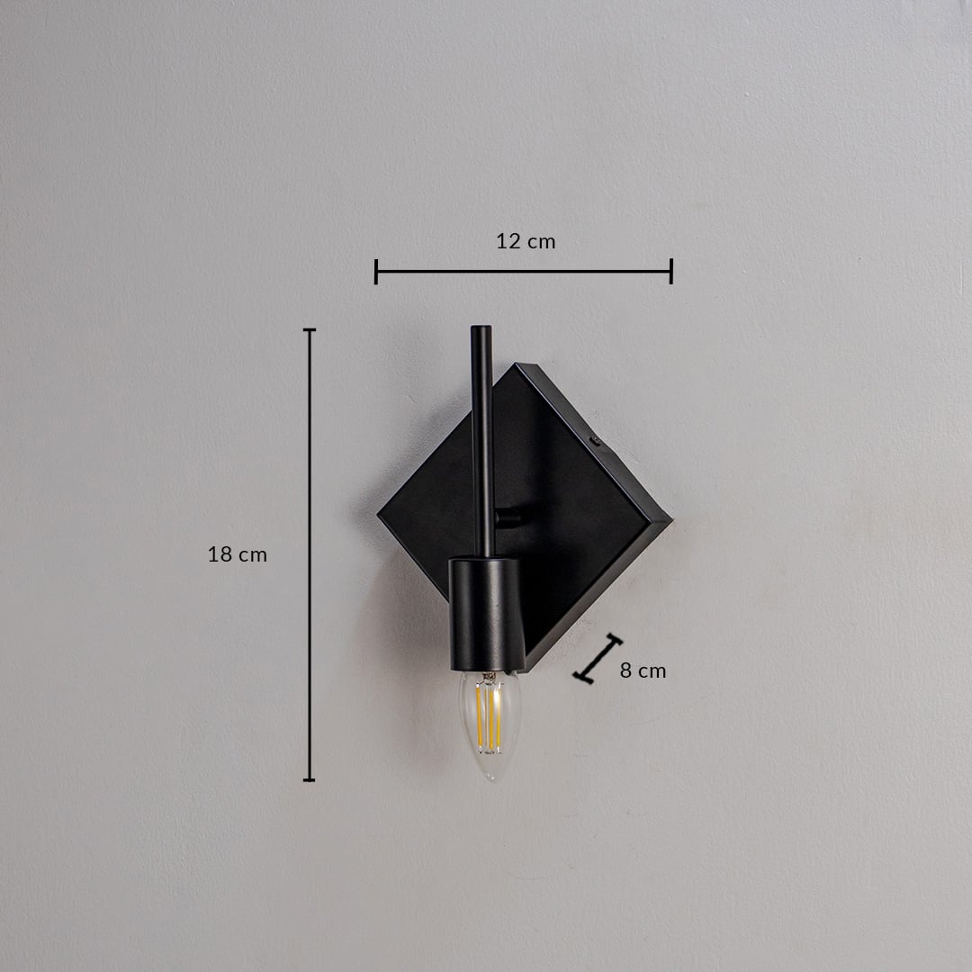 Black wall light with gold bulb holder and circular frame shown on white background measuring 27cm height and 25cm width.