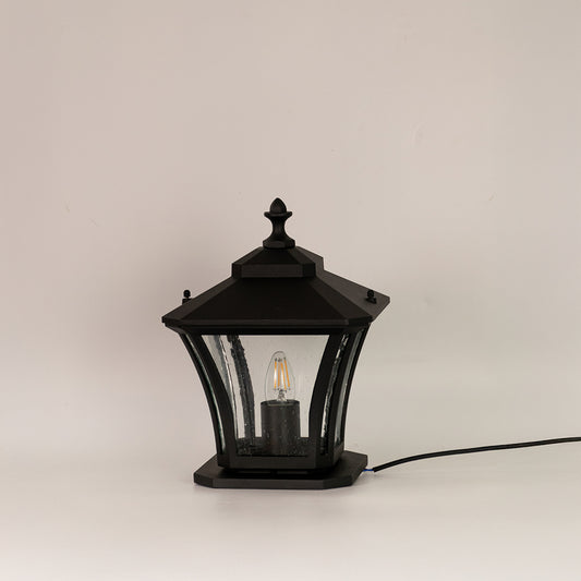 Black outdoor gate light with clear curved glass panels for stylish exterior decor styling use.