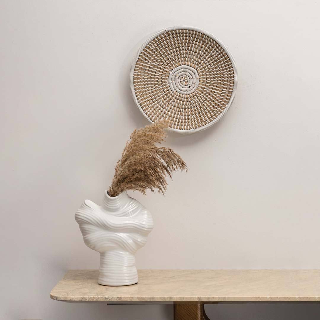 Handcrafted natural seagrass wall basket for living room shelf and modern boho home décor styling with artisan finish.
