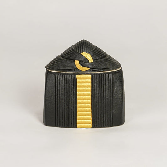 Black ceramic decorative jar with gold accent lid perfect for jewelry trinket storage on dresser vanity and modern decor.