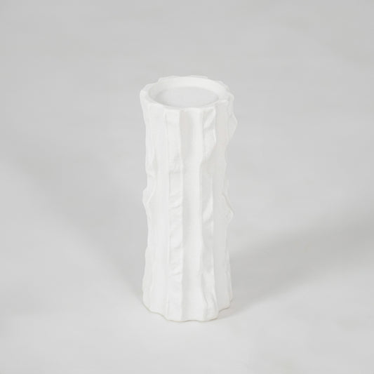 White textured ceramic vase for modern shelf placement and elegant indoor home decor styling accent piece.