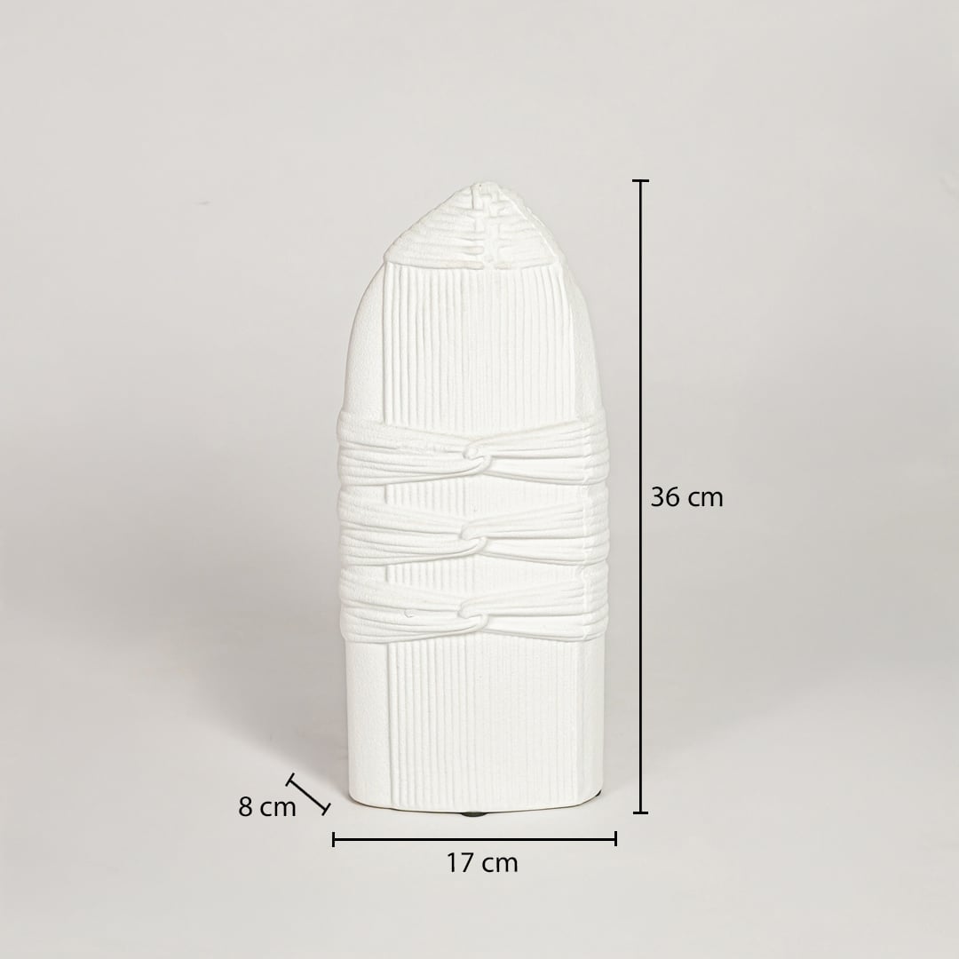 White ceramic sculpted decorative vase measuring 36 cm height 17 cm width and 8 cm depth ideal for modern decor placement.