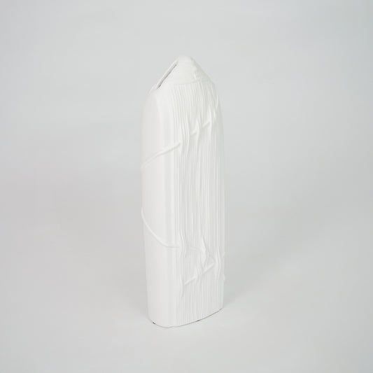 White geometric ceramic decor object for elegant coffee table placement and minimalist indoor decor styling accent.