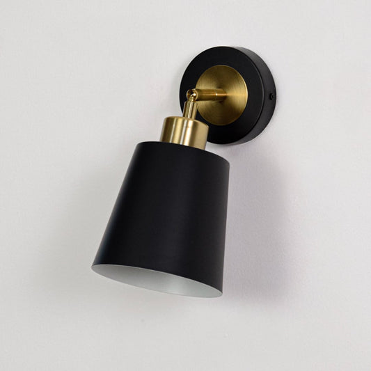 Black metal wall sconce with gold arm turned off on a white background showcasing clean finish premium material and modern design.