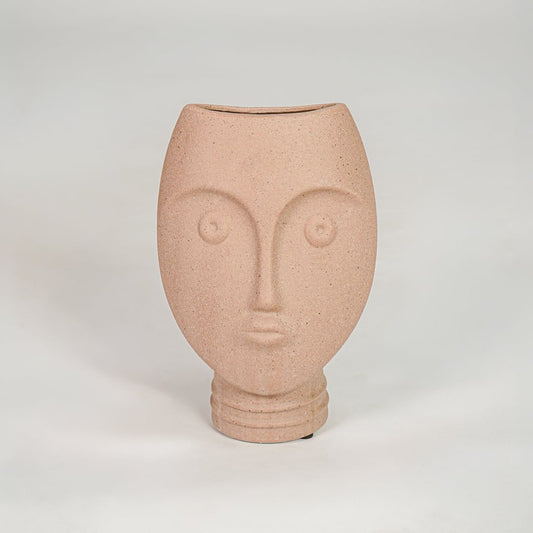 Pink textured face ceramic vase for stylish console table placement and contemporary indoor decor styling.