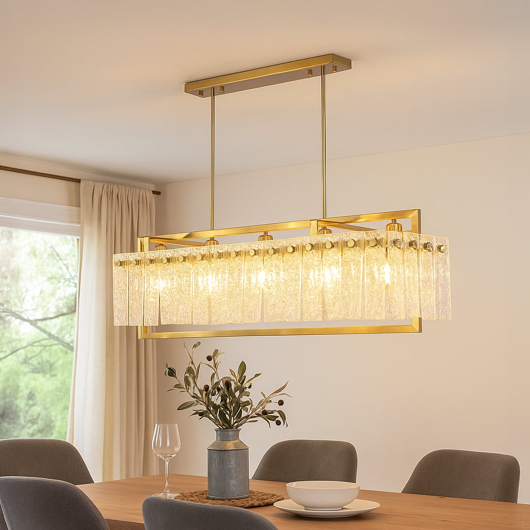 Gold crystal chandelier with cascading glass accents illuminating elegant dining room creating luxurious modern interior.