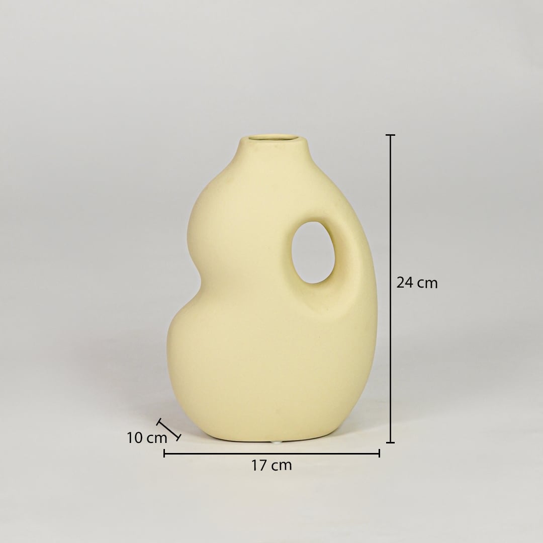 Yellow ceramic decorative vase size 24 cm height 17 cm width 10 cm depth modern designer vase for table console styling.