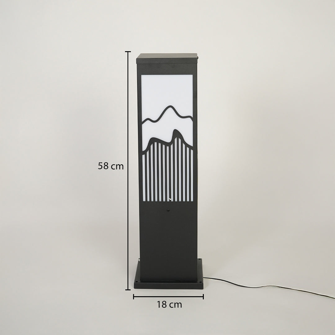 Modern outdoor bollard light with black metal frame and mountain pattern diffuser on neutral background 58 cm height 18 cm width ideal for garden pathway lighting.