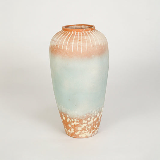 White background image of blue ceramic decorative vase for modern floor placement with textured matte finish.