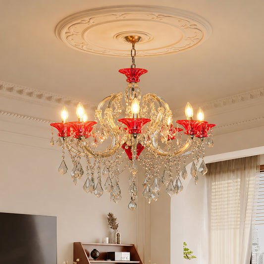 Lifestyle image of red and clear glass baccarat style chandelier for luxury dining room decor styling with elegant detailing.