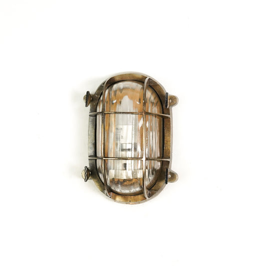 White background image of nautical steampunk bulkhead sconce light fixture for elegant home exterior decor and wall lighting.