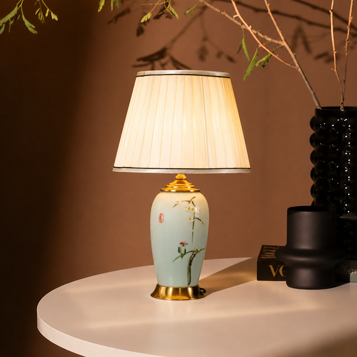 Decorative table lamp with floral design on a round surface against a brown background