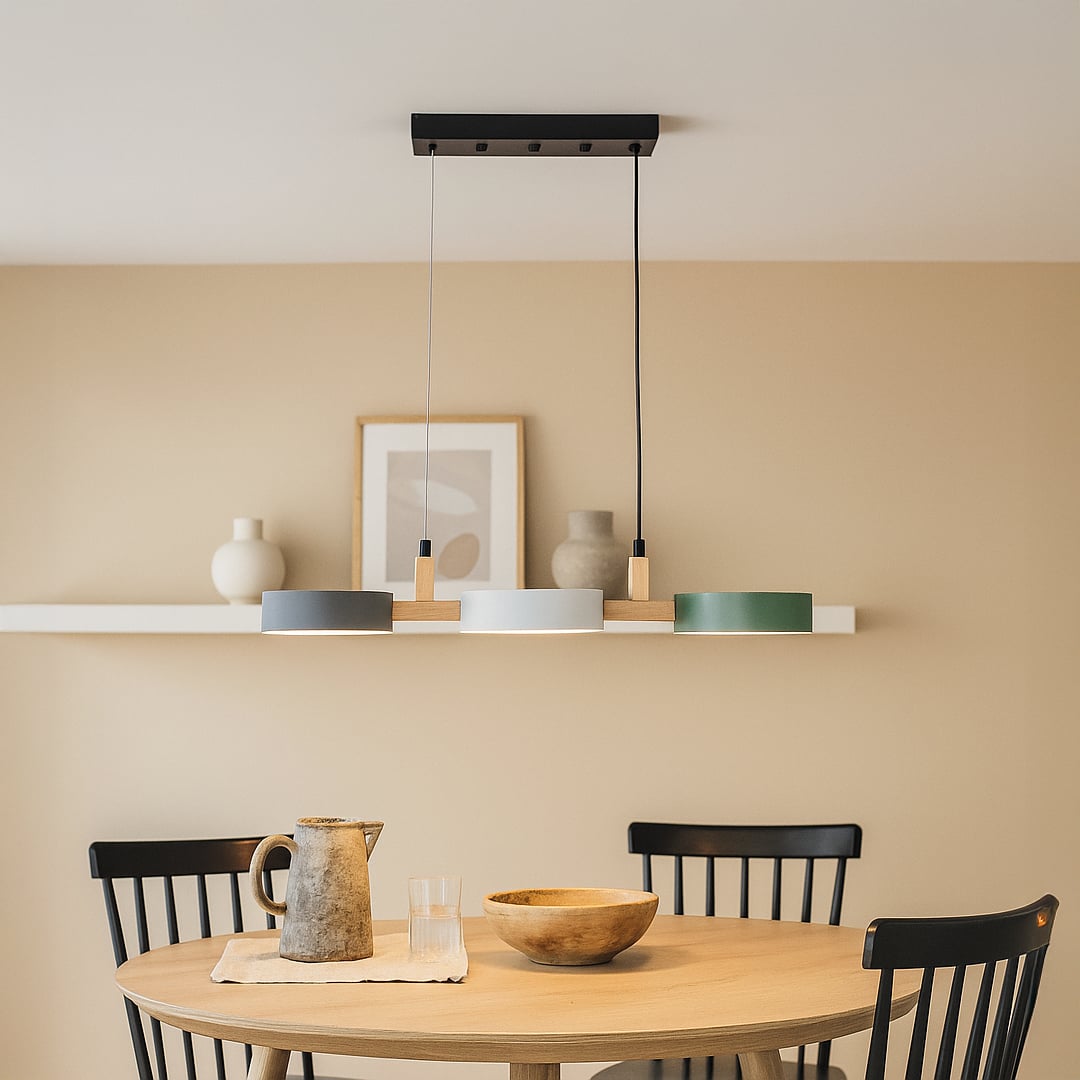 Linear gold metal pendant light creating elegant ambience above the dining table in modern interiors.