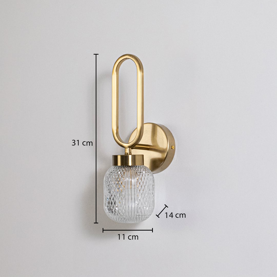 Gold wall sconce with oval loop frame and textured glass shade shown with size 31 cm height 11 cm width 14 cm depth fitting guide.