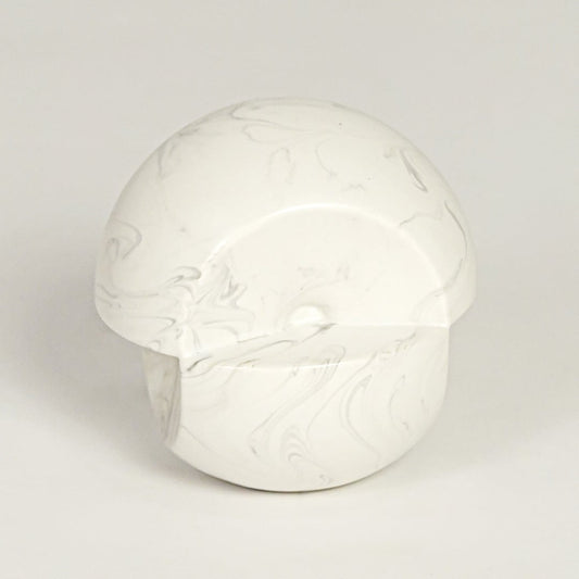 Modern white marble look ceramic statement decor piece with organic rounded silhouette for contemporary interiors.